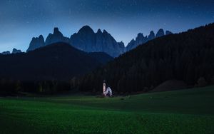 Preview wallpaper mountains, lawn, night, building, landscape