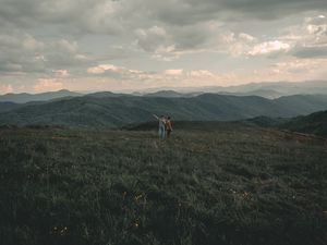 Preview wallpaper mountains, lawn, people, greenery, landscape