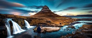 Preview wallpaper mountains, man, starry sky, waterfall, river