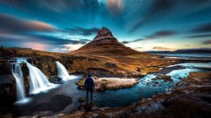 Preview wallpaper mountains, man, starry sky, waterfall, river