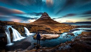 Preview wallpaper mountains, man, starry sky, waterfall, river