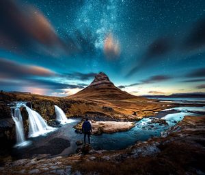 Preview wallpaper mountains, man, starry sky, waterfall, river