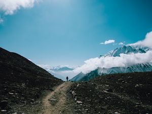 Preview wallpaper mountains, man, tourist, clouds