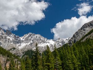 Preview wallpaper mountains, mountain range, peaks, trees, clouds