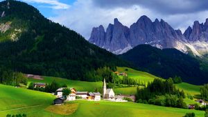 Preview wallpaper mountains, mountain range, village, clouds, grass, trees