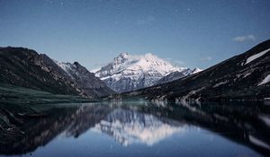 Preview wallpaper mountains, night, starry sky, reflection, snowy