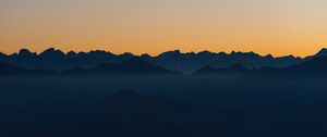 Preview wallpaper mountains, outlines, sunset, peaks, sky