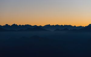 Preview wallpaper mountains, outlines, sunset, peaks, sky