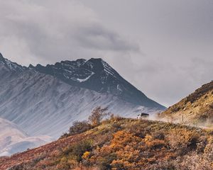 Preview wallpaper mountains, peak, car, off-road, nature