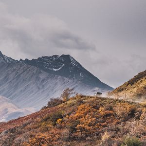 Preview wallpaper mountains, peak, car, off-road, nature