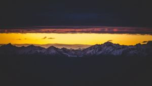 Preview wallpaper mountains, peak, clouds, night, sky, dark, snowy