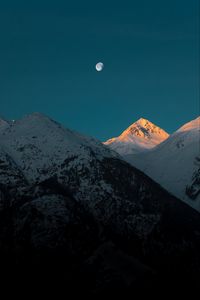 Preview wallpaper mountains, peak, moon, snowy, twilight