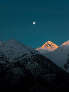 Preview wallpaper mountains, peak, moon, snowy, twilight