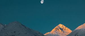 Preview wallpaper mountains, peak, moon, snowy, twilight