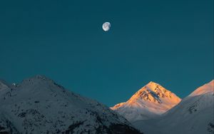 Preview wallpaper mountains, peak, moon, snowy, twilight