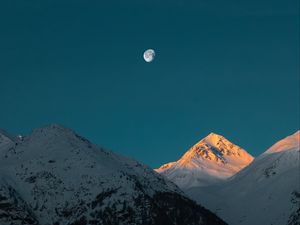 Preview wallpaper mountains, peak, moon, snowy, twilight