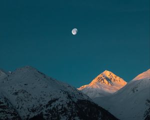 Preview wallpaper mountains, peak, moon, snowy, twilight