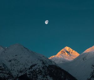 Preview wallpaper mountains, peak, moon, snowy, twilight