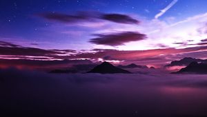 Preview wallpaper mountains, peaks, clouds, starry sky, aerial view, night