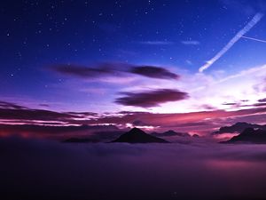 Preview wallpaper mountains, peaks, clouds, starry sky, aerial view, night