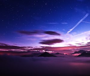 Preview wallpaper mountains, peaks, clouds, starry sky, aerial view, night