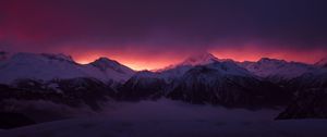 Preview wallpaper mountains, peaks, fog, sunset, sky, snow, clouds, dark