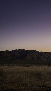 Preview wallpaper mountains, peaks, grass, twilight, sky