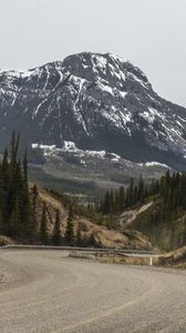 Preview wallpaper mountains, peaks, road, forest, snowy