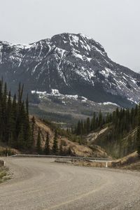 Preview wallpaper mountains, peaks, road, forest, snowy