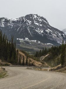 Preview wallpaper mountains, peaks, road, forest, snowy