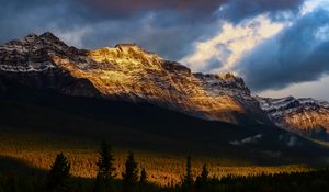 Preview wallpaper mountains, peaks, rock, rays, forest
