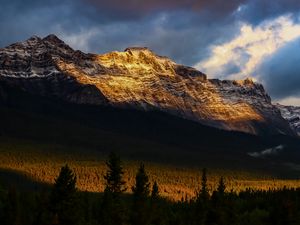 Preview wallpaper mountains, peaks, rock, rays, forest