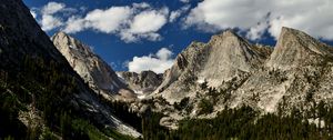 Preview wallpaper mountains, peaks, rocks, trees, spruce, sky