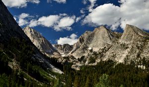 Preview wallpaper mountains, peaks, rocks, trees, spruce, sky