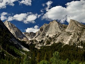 Preview wallpaper mountains, peaks, rocks, trees, spruce, sky