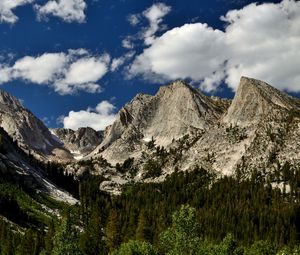 Preview wallpaper mountains, peaks, rocks, trees, spruce, sky