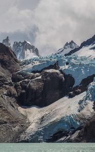 Preview wallpaper mountains, peaks, rocky, rock formation, clouds