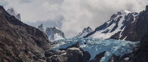 Preview wallpaper mountains, peaks, rocky, rock formation, clouds