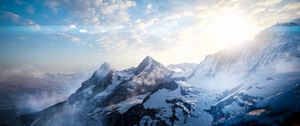 Preview wallpaper mountains, peaks, sky, snowy, view from above, sunlight