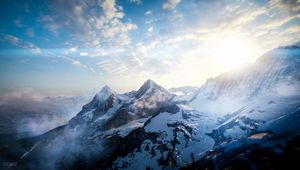 Preview wallpaper mountains, peaks, sky, snowy, view from above, sunlight