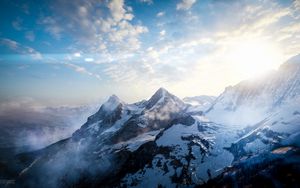 Preview wallpaper mountains, peaks, sky, snowy, view from above, sunlight