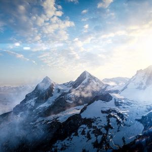 Preview wallpaper mountains, peaks, sky, snowy, view from above, sunlight