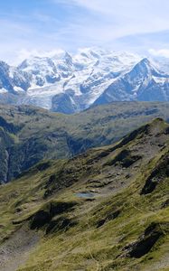 Preview wallpaper mountains, peaks, snow, grass, clouds