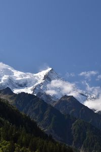 Preview wallpaper mountains, peaks, snow, trees, slope, forest, nature