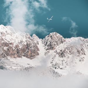 Preview wallpaper mountains, peaks, snow, airplane, clouds