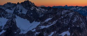 Preview wallpaper mountains, peaks, snowy, sunset, evening, sky
