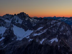 Preview wallpaper mountains, peaks, snowy, sunset, evening, sky