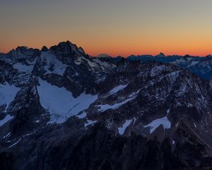 Preview wallpaper mountains, peaks, snowy, sunset, evening, sky