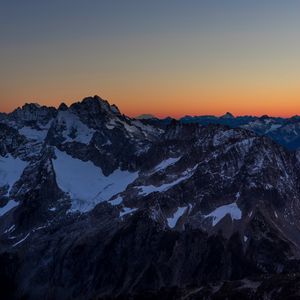 Preview wallpaper mountains, peaks, snowy, sunset, evening, sky