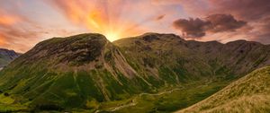 Preview wallpaper mountains, peaks, sunset, grass, meadow